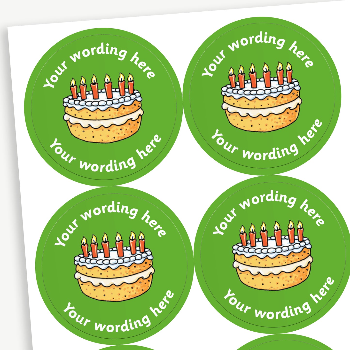 Sheet of round yellow stickers featuring birthday cake with 6 candles in the centre. Each sticker has placeholder text reading 'Your wording here' curved above and below the illustration. 