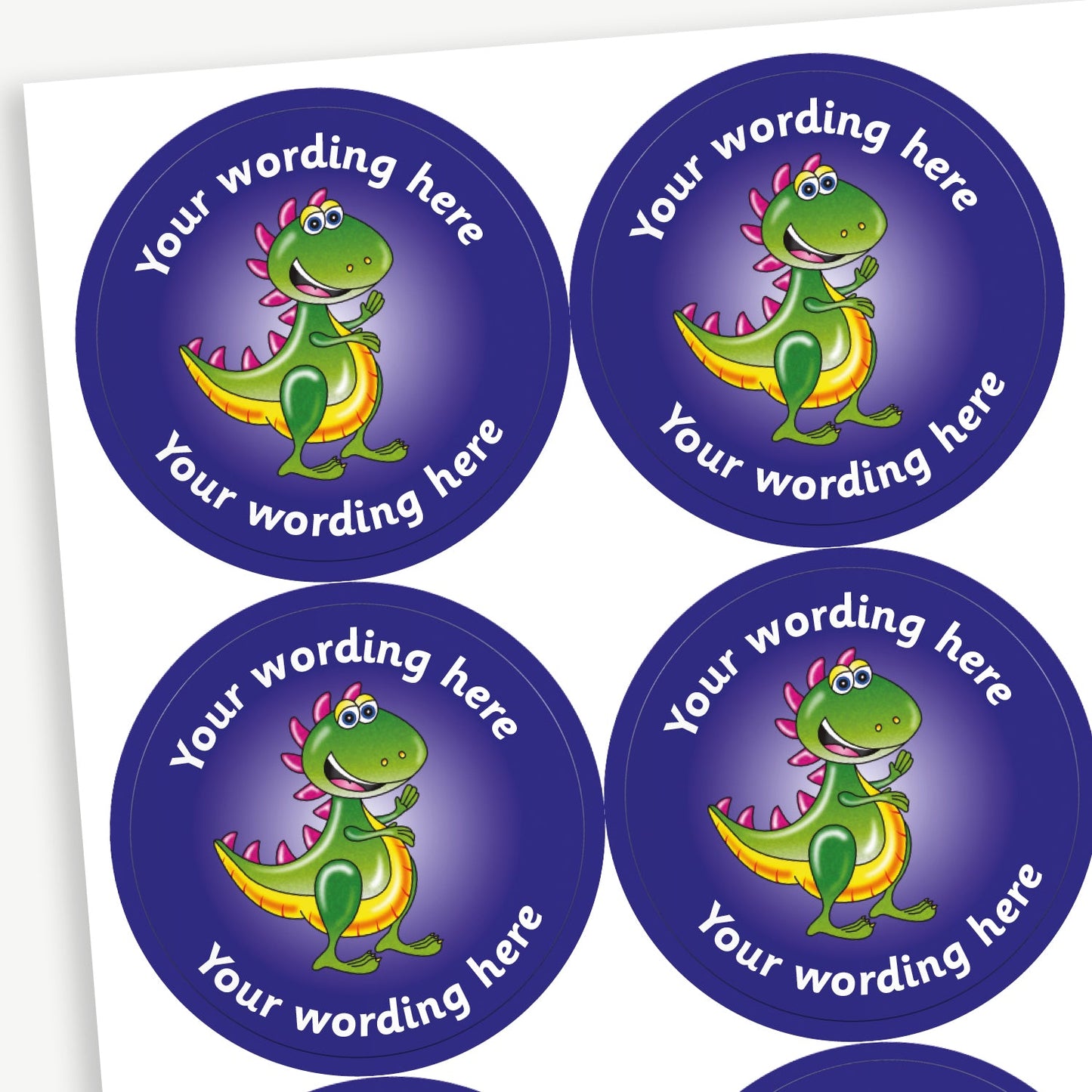 A sheet of purple circular stickers featuring a smiling cartoon T.Rex dinosaur; curving above and below the image is space for personalisation 'Your wording here' in a clear, bold font.