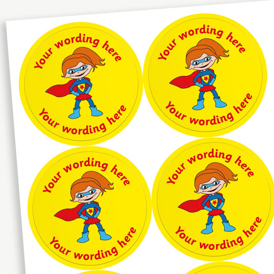 A sheet of yellow stickers featuring a girl superhero in a cape in the centre.  Placeholder text 'Your wording here' is above and below the image for customisation.