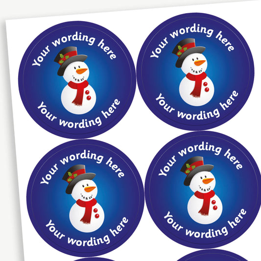 A sheet of blue stickers featuring a snowman with a top hat and scarf in the centre.  Placeholder text 'Your wording here' is above and below the image for customisation.