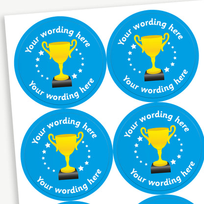 Circular 37mm stickers, cyan in colour and each featuring a golden trophy icon at the centre, surrounded by white stars, with customisable text above and below the trophy - choice of colours