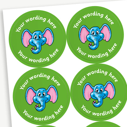 Sheet of round green stickers featuring an elephants head in the centre. Each sticker has placeholder text reading 'Your wording here' curved above and below the illustration for customisation.