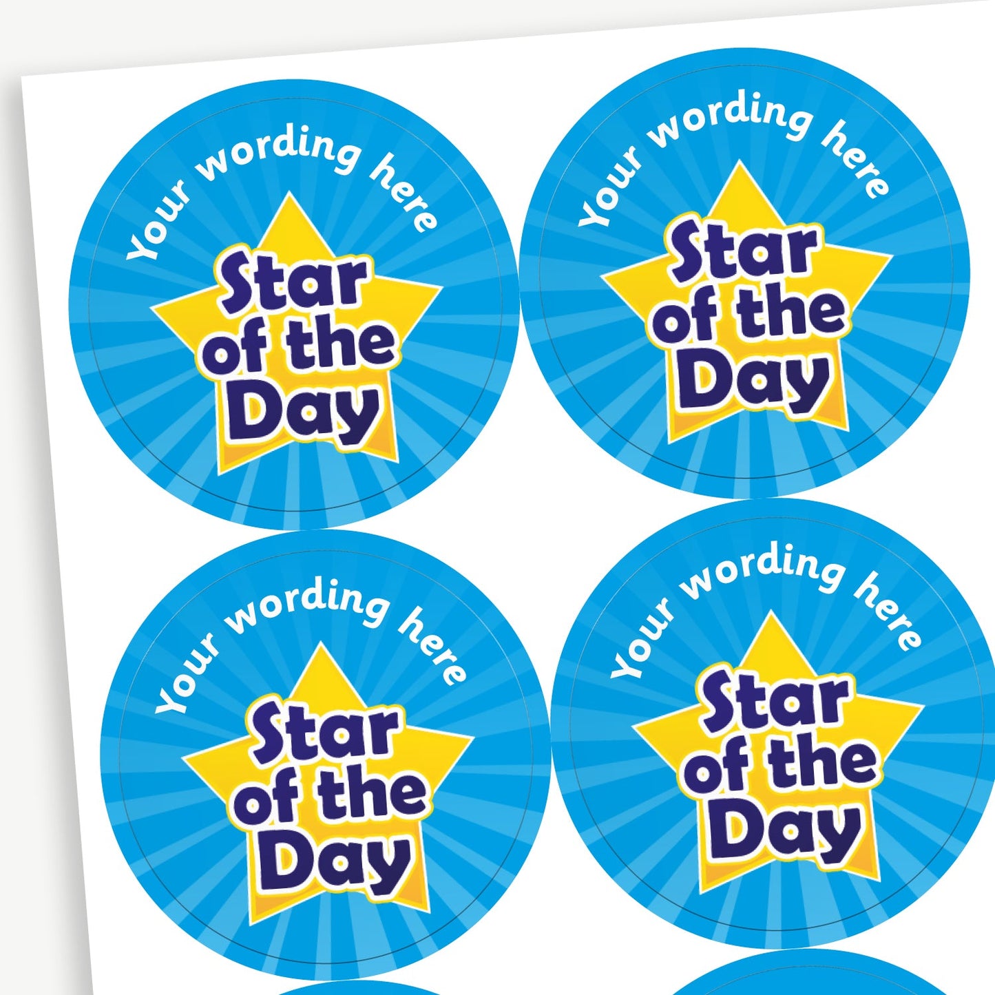 A sheet of round cyan starburst effect stickers, each featuring a large golden star with the text 'Star of the Day' in bold blue letters. The top arc of each sticker has placeholder text 'Your wording here' for customisation.