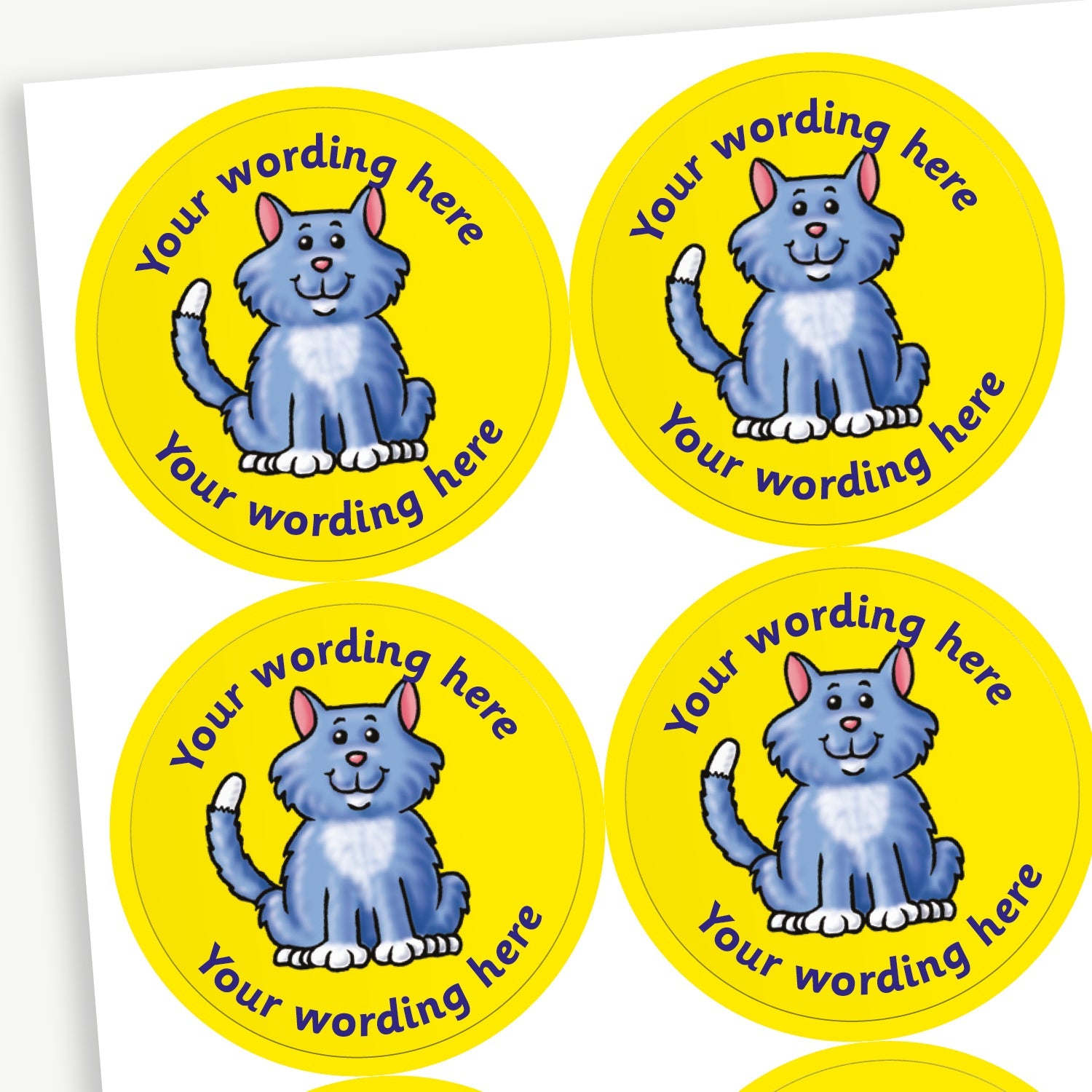 Sheet of round yellow stickers featuring grey and white cat sat in the centre. Each sticker has placeholder text reading 'Your wording here' curved above and below the illustration. 
