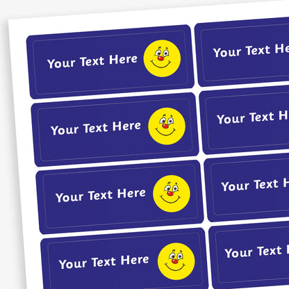 Sheet of rectangular dark blue stickers with white placeholder text reading 'Your Text Here'. Each sticker features a small illustration yellow smiling face with a red nose.