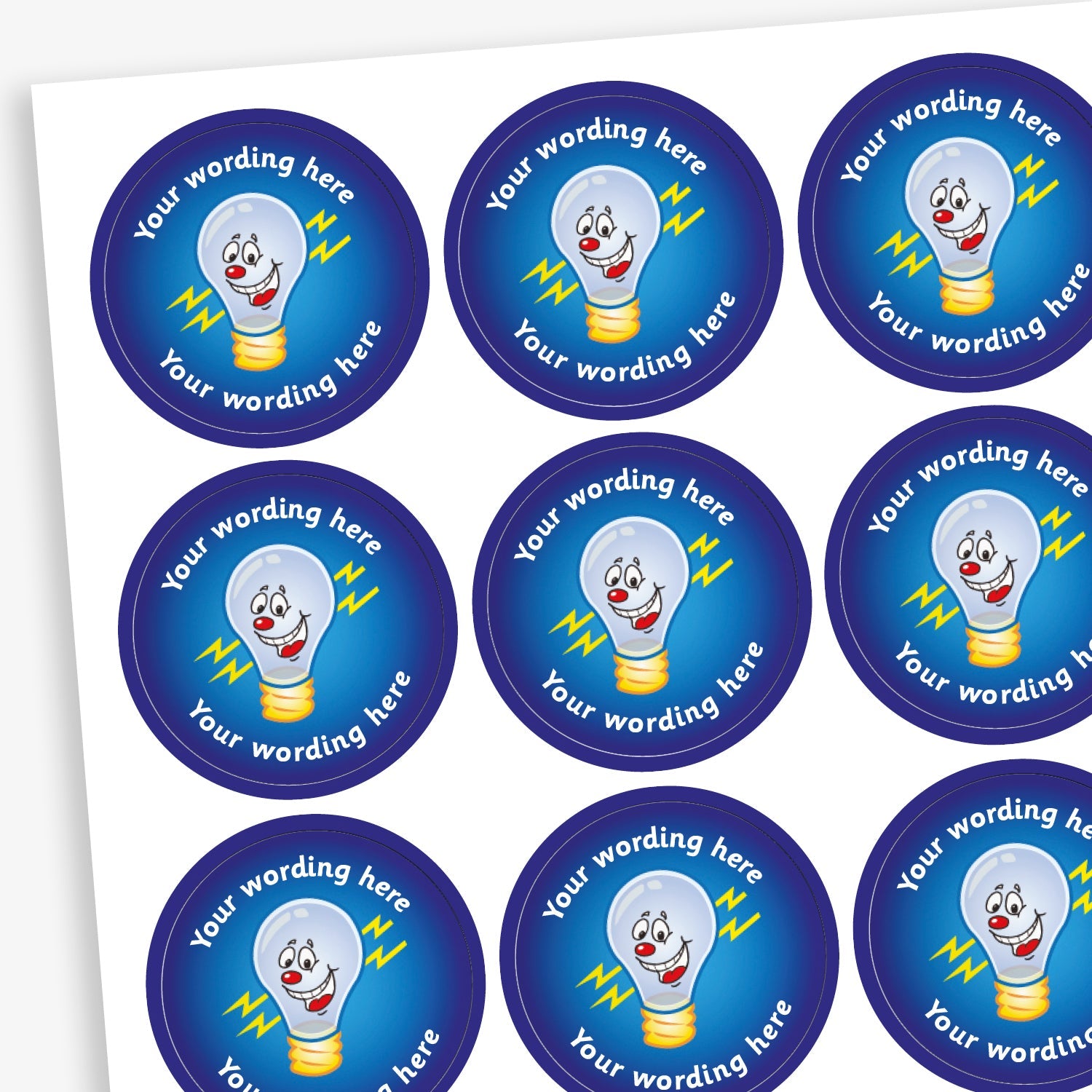 A sheet of circular reward stickers featuring a blue gradient background with a smiling lightbulb in the centre. Each sticker includes the placeholder text 'Your wording here' curved along the top and bottom edges, indicating customisable space for personalised messages