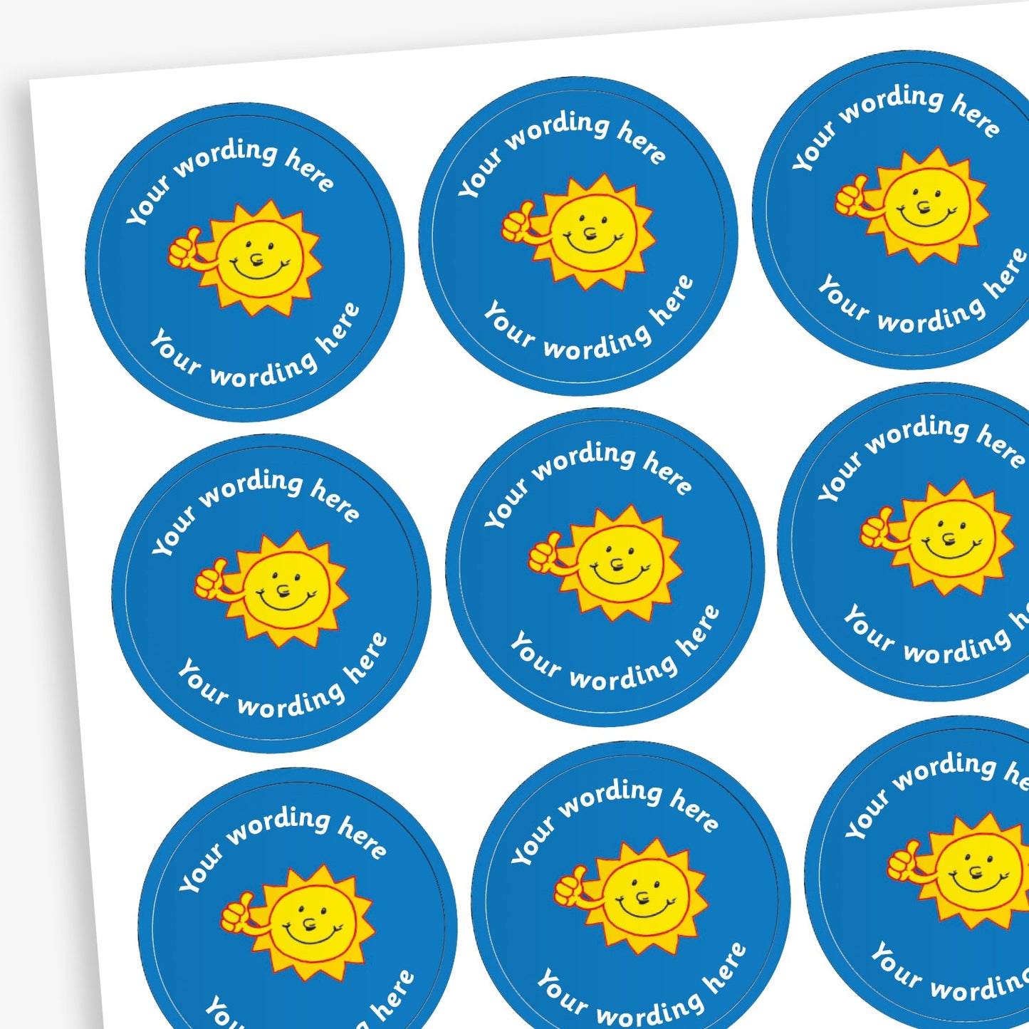 A sheet of circular, blue reward stickers featuring a smiling sun with a thumbs up. Placeholder text above and below 'Your wording here' indicate customisation options.