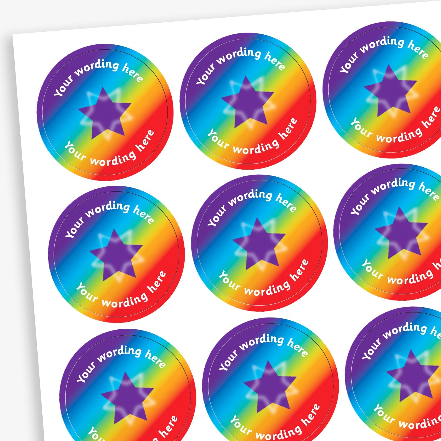 A collection of personalised rainbow star stickers with a 25mm diameter, arranged in a grid pattern on a piece of paper. Each sticker has a colourful border with a star in the centre and a customizable text label above and below the star.