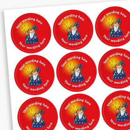 A sheet of circular, red reward sticker featuring a cartoon wizard in a blue robe and hat with a wand emitting a shower of stars. The stickers has placeholder text 'Your wording here' above and below the wizard for customisation.