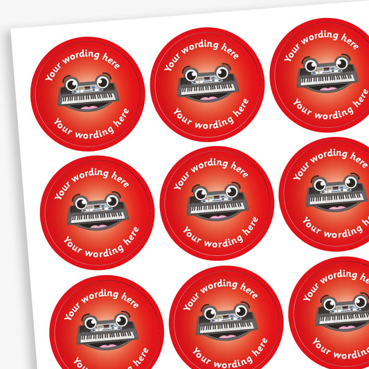 A sheet of circular reward stickers featuring a red gradient background with a smiling keyboard in the centre. Each sticker includes the placeholder text 'Your wording here' curved along the top and bottom edges, indicating customisable space for personalised messages