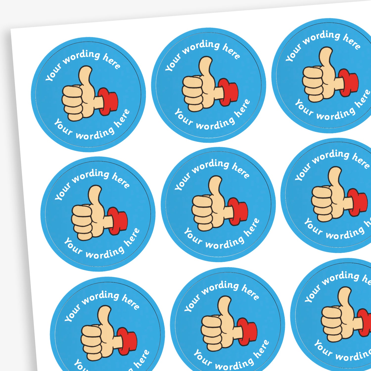 A sheet of circular, blue reward stickers featuring a hand with a thumbs up. Placeholder text above and below 'Your wording here' indicate customisation options.