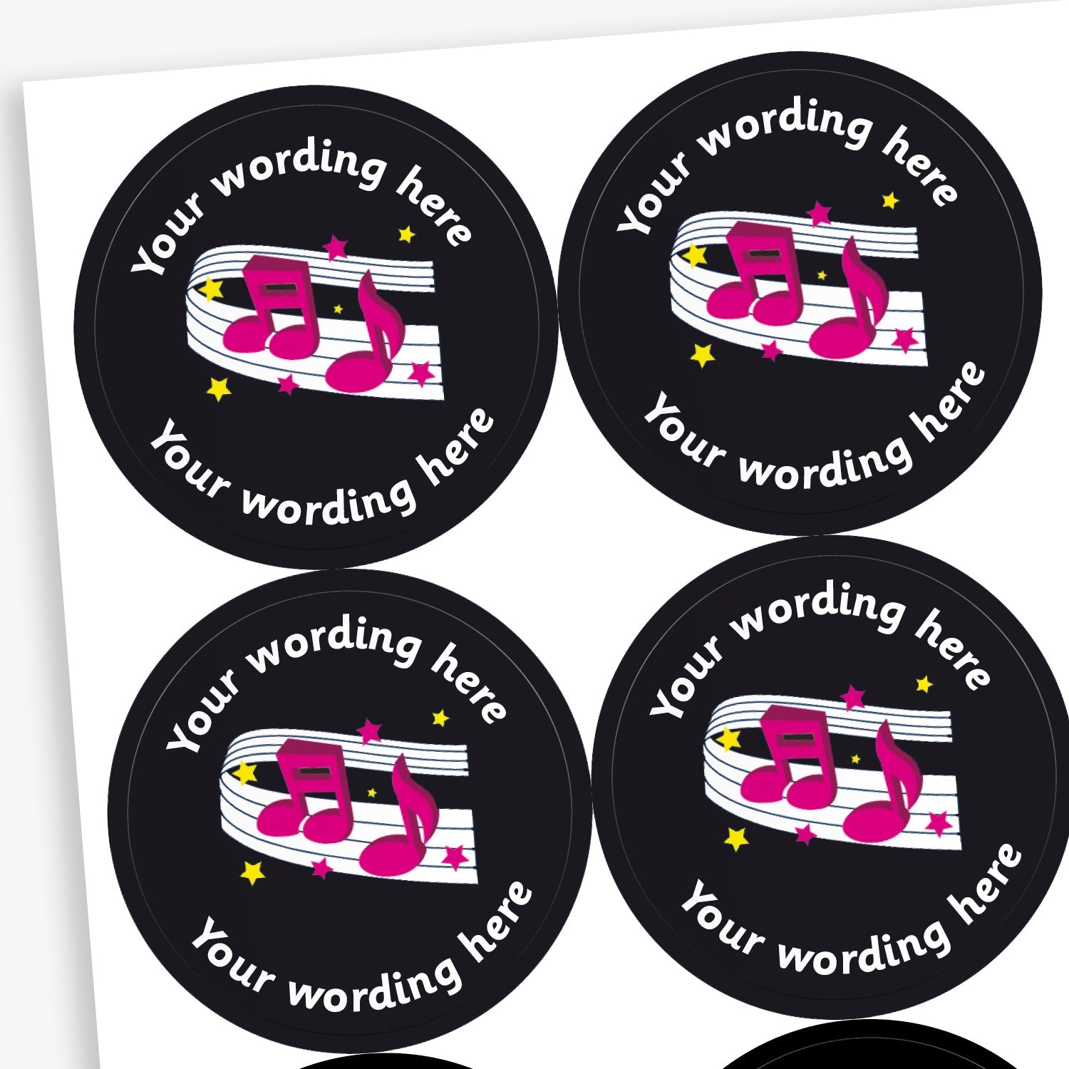Circular reward stickers with a black background featuring pink musical notes on a music staff. Yellow and pink stars are scattered throughout the design. Each sticker includes placeholder text 'Your wording here' curved along the top edge for customisation.