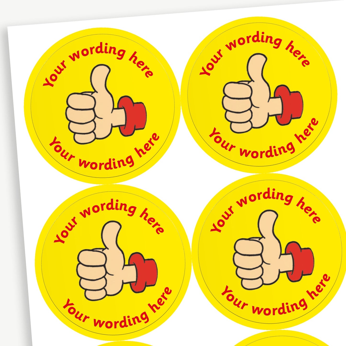 A sheet of yellow stickers featuring a thumbs up in the centre.  Placeholder text 'Your wording here' is above and below the image for customisation.