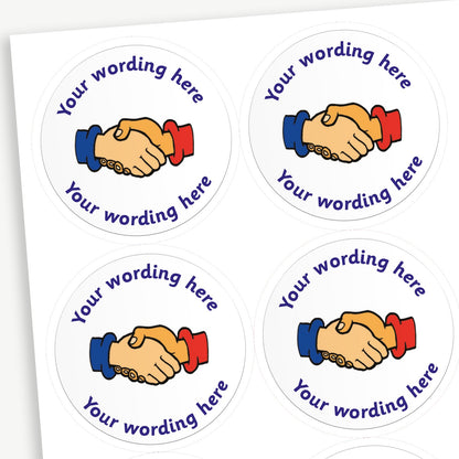 A sheet of white stickers.  A central image of two hands being shaken - one with a blue cuff and one with a red cuff.  Placeholder text 'Your wording here' is above and below the image.