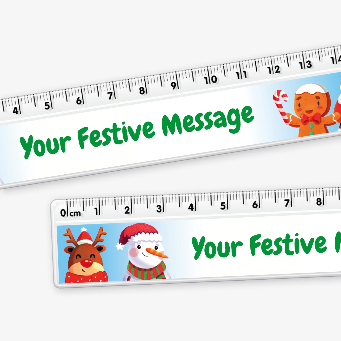 Close up of a festive 15cm white plastic ruler featuring cartoon images of a reindeer, snowman, gingerbread figure, and Father Christmas, with a space in the centre for a custom festive message.