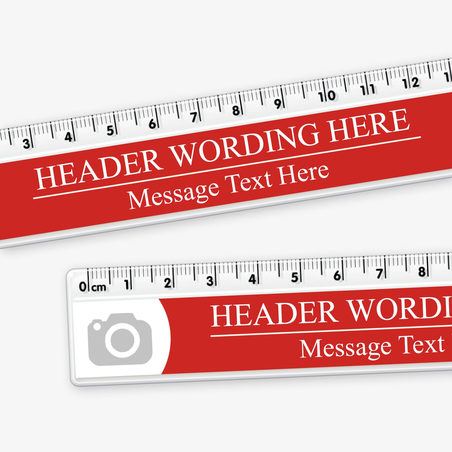 Close up of customisable 15cm plastic ruler with a red background. Includes placeholder text 'HEADER WORDING HERE' and 'Message Text Here' in white, with camera icons at both ends indicating space for logos or images. The ruler features centimetre and millimetre markings along the top edge.