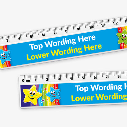 A colourful 15cm plastic ruler with a clear measuring edge marked in centimetres and millimetres. The central section features a blue background with placeholder text reading 'Top Wording Here' and 'Lower Wording Here' in yellow. Cartoon stars with smiling faces and vibrant colours—yellow, blue, green, and red—decorate both ends of the ruler.