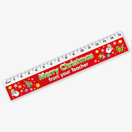 A red 15cm ruler featuring the phrase 'Merry Christmas' in bold green letters, and underneath in bold whote letters 'from your Teacher' decorated with colourful festive icons like Father Christmas, Christmas tree, present, bells and stars.
