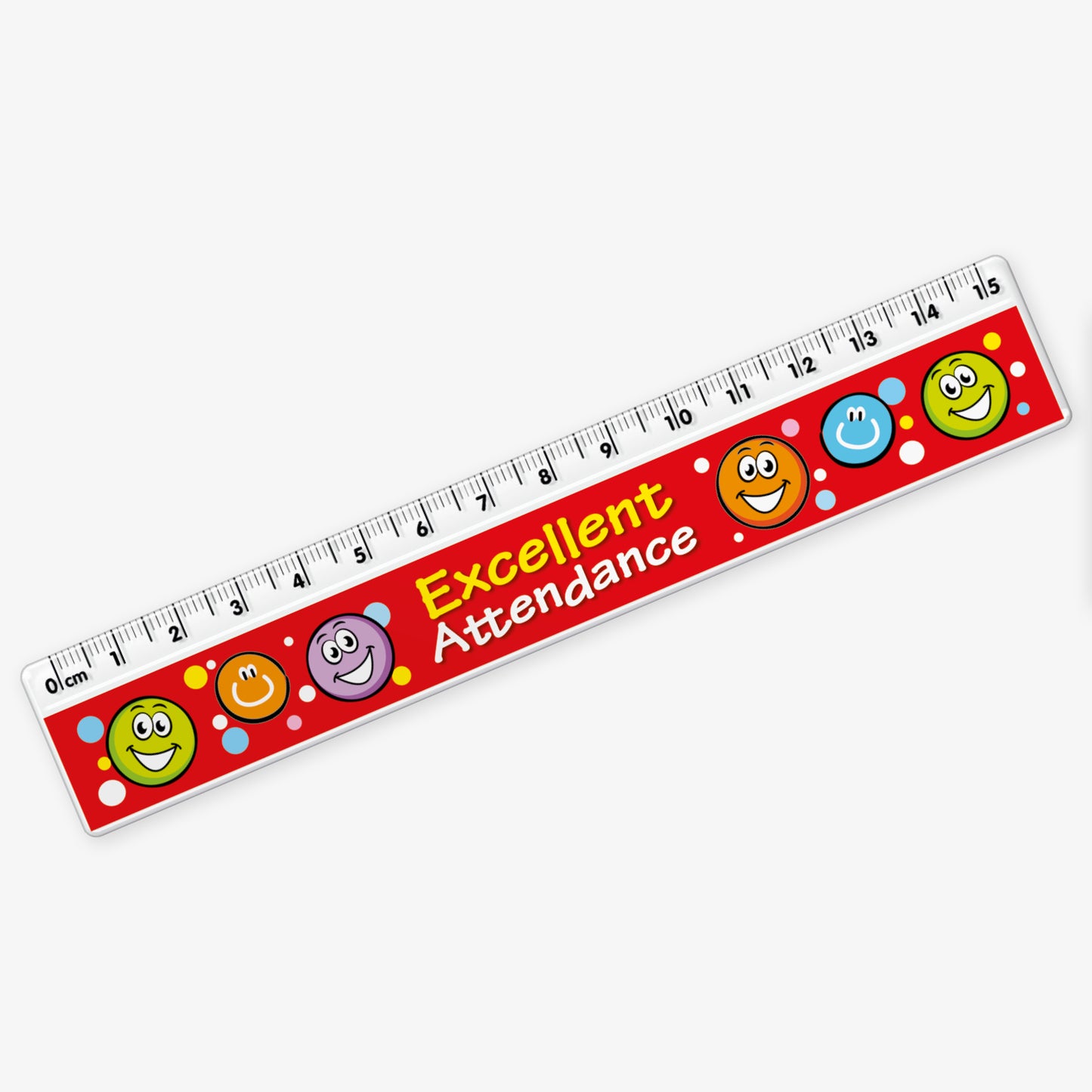 A 15cm ruler with a red background, decorated with colourful smiley face icons and white polka dots. The ruler features the words 'Excellent Attendance' in bold yellow and white text across the middle.