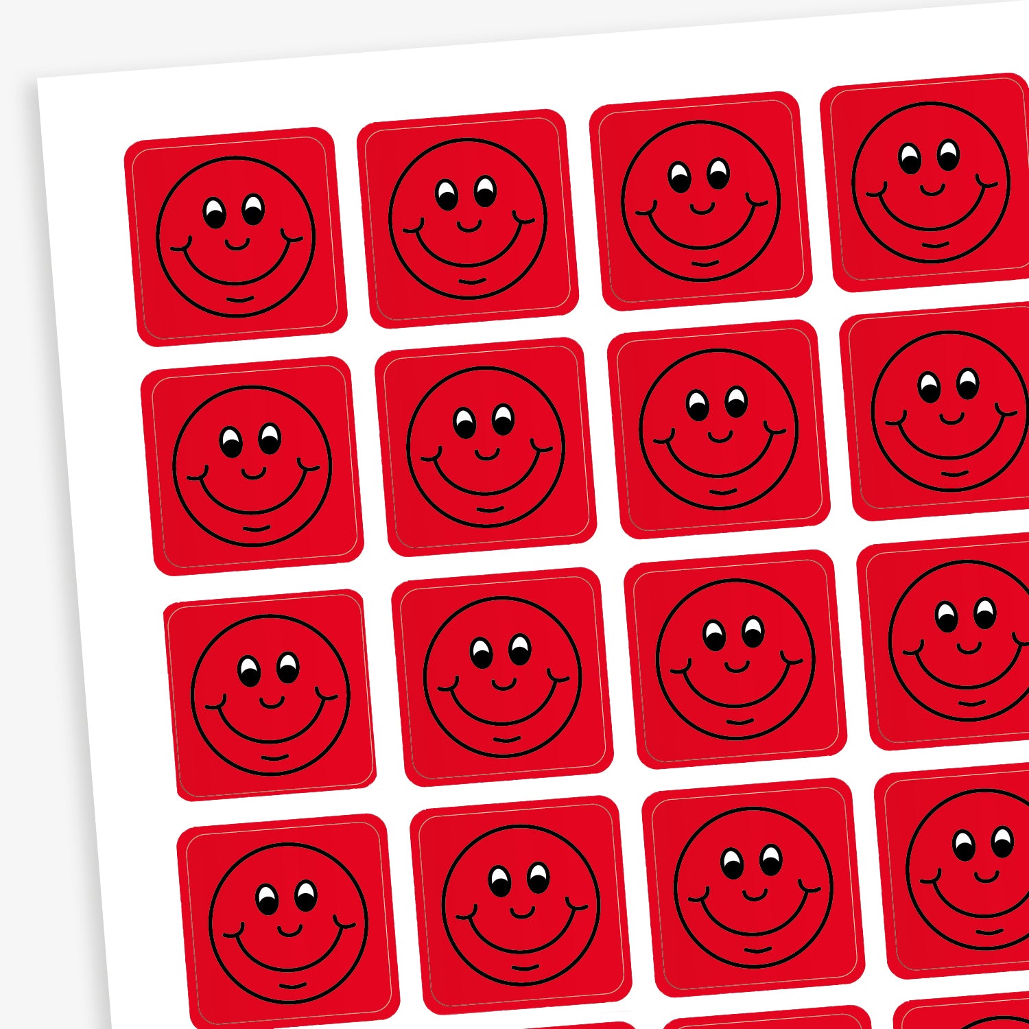 A sheet of 140 square 16mm reward stickers, each featuring a black outline of a smiling comical face, set against a vibrant red background.
