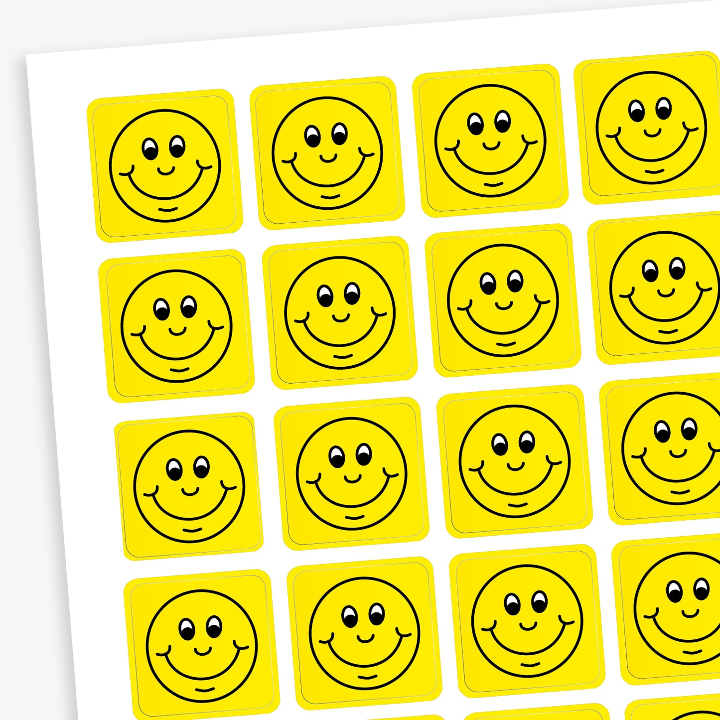 A sheet of 140 square 16mm reward stickers, each featuring a black outline of a smiling comical face, set against a vibrant yellow background.