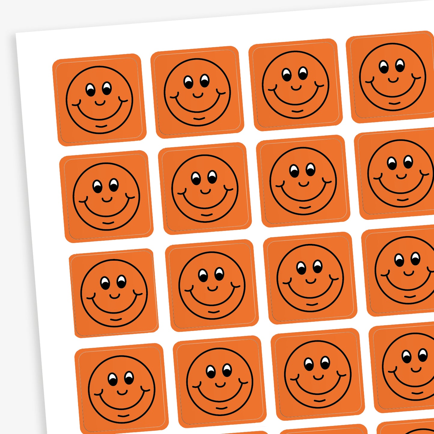 A sheet of 140 square 16mm reward stickers, each featuring a black outline of a smiling comical face, set against a vibrant orange background.