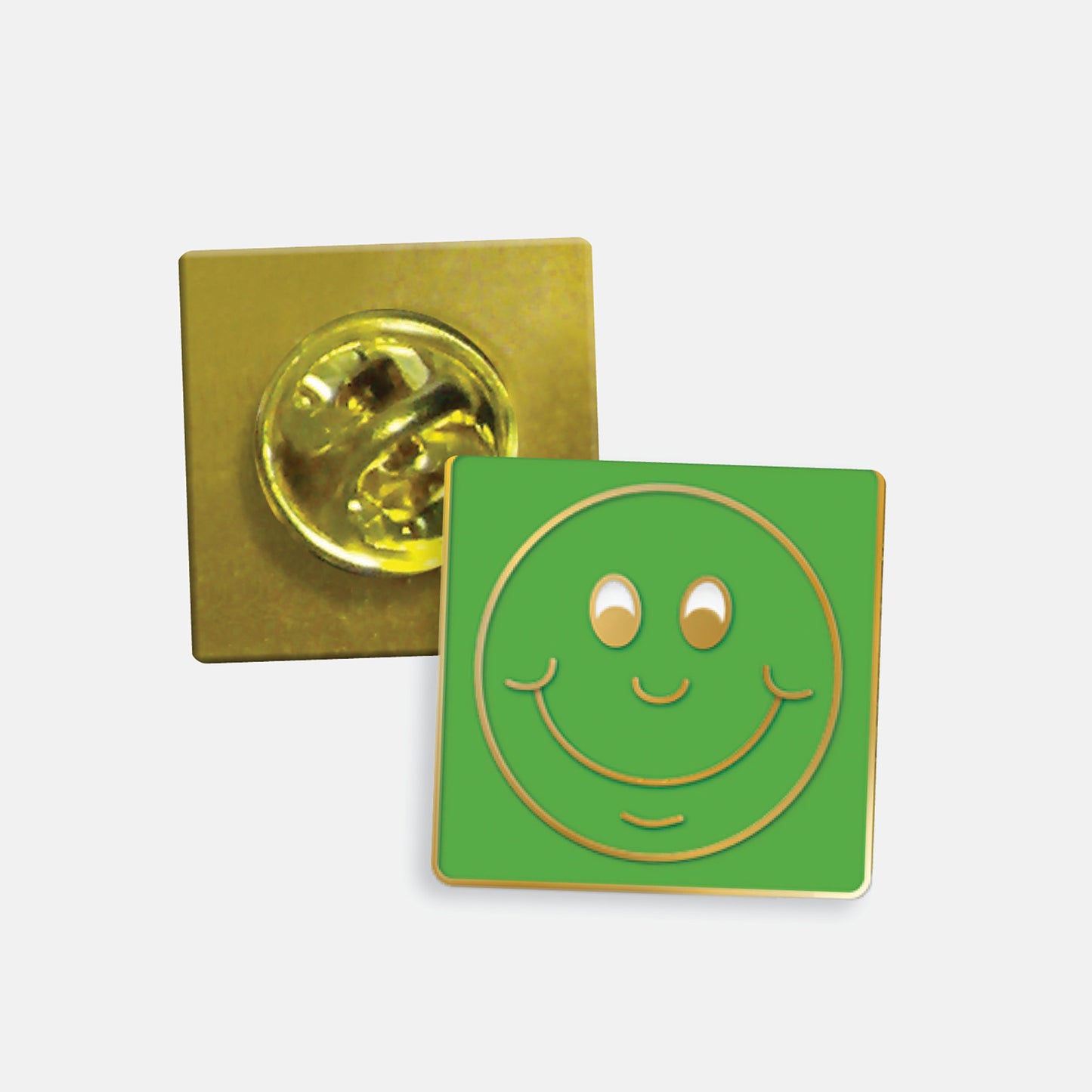 Green enamel square badge with a gold smiling face as it's design. The reverse side shows a gold back with a butterflyfastening
