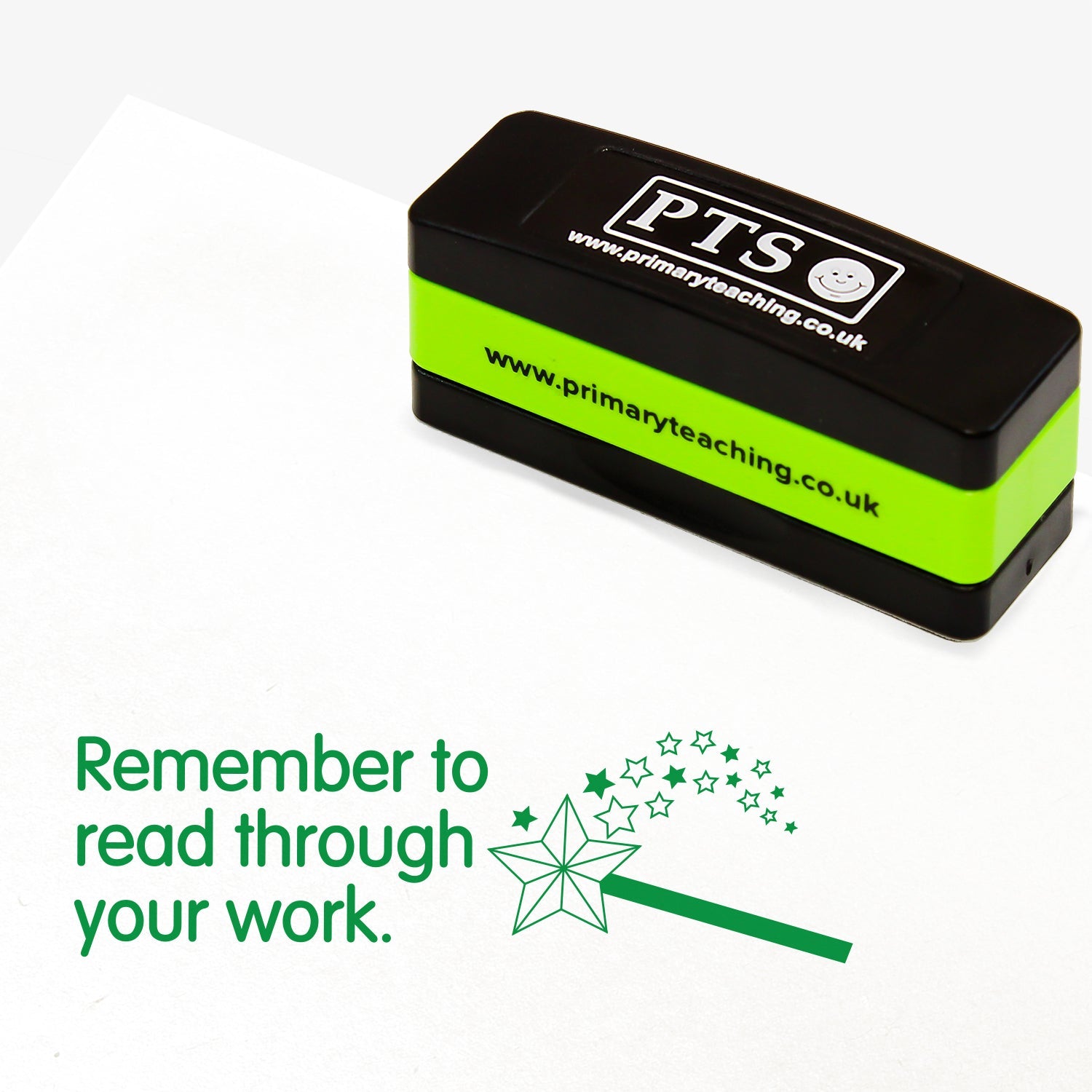 Rectangular self-inking stamper measuring 44mm by 13mm, featuring a green impression lined writing paper of the phrase 'Remember to read through your work.' alongside an image of a wand emitting stars.