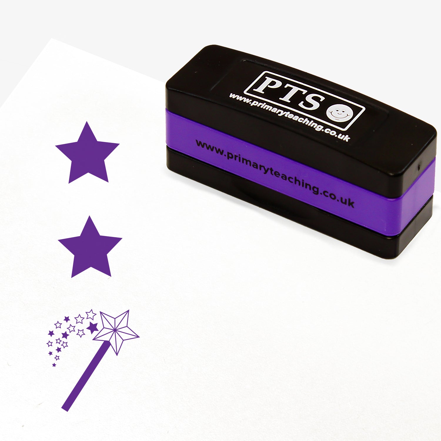 Rectangular self-inking, stackable, stamper 44mm x 13mm with purple ink, featuring a purple vertical impression: a star at the top, a star in the middle and a wand with a shower of stars underneath.