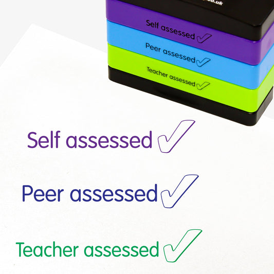 3 stacked rectangular self-inking stampers measuring 44mm by 13mm, featuring the imprint - 'Self Assessed' with a tick icon in purple ink; 'Peer assessed' with a tick icon in blue ink; 'Teacher assessed' with a tick icon in green ink.