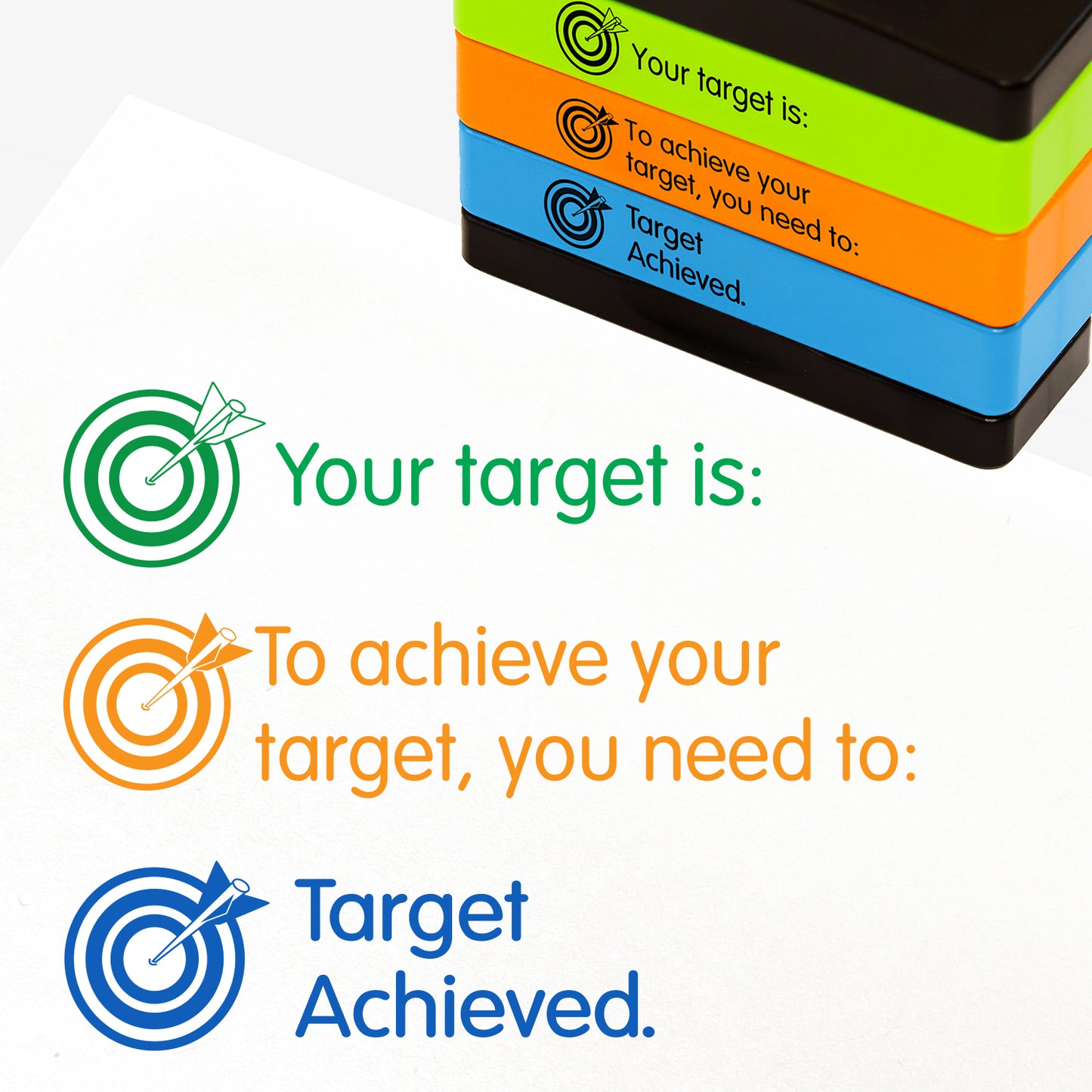 3 stacked rectangular self-inking stampers measuring 44mm by 13mm, featuring the imprint - 'Your target is:' in green ink with an arrow in the bullseye of a target; 'To achieve your target, you need to:' in orange ink with an arrow in the bullseye of a target; 'Target Achieved.' in blue ink with an arrow in the bullseye of a target;