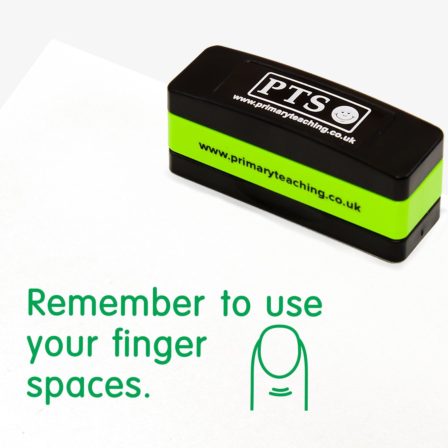 Rectangular self-inking, stackable stamper 44mm x 13mm with green ink, featuring the phrase 'Remember to use your finger spaces' followed by an illustration of a finger.