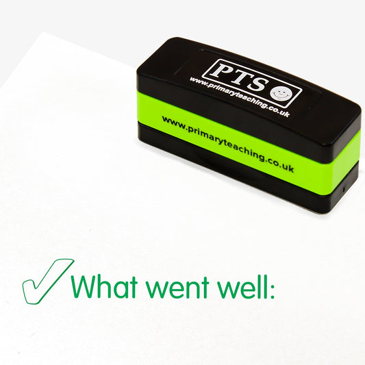 Rectangular self-inking, stackable stamper 44mm x 13mm with green ink, displaying the text 'What Went Well:' alongside the green outline of a tick.
