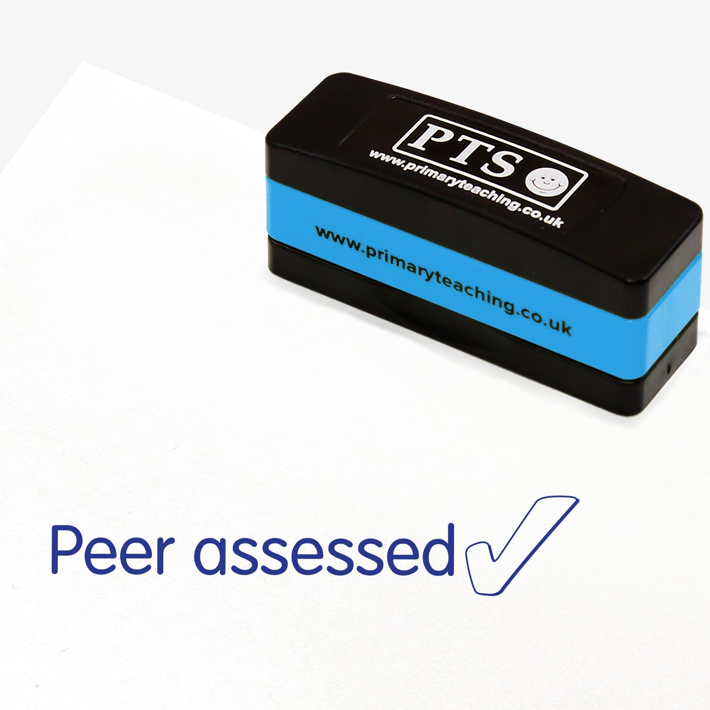 Rectangular self-inking stamper measuring 44mm by 13mm, featuring the phrase 'Peer assessed' and a tick icon in blue ink.