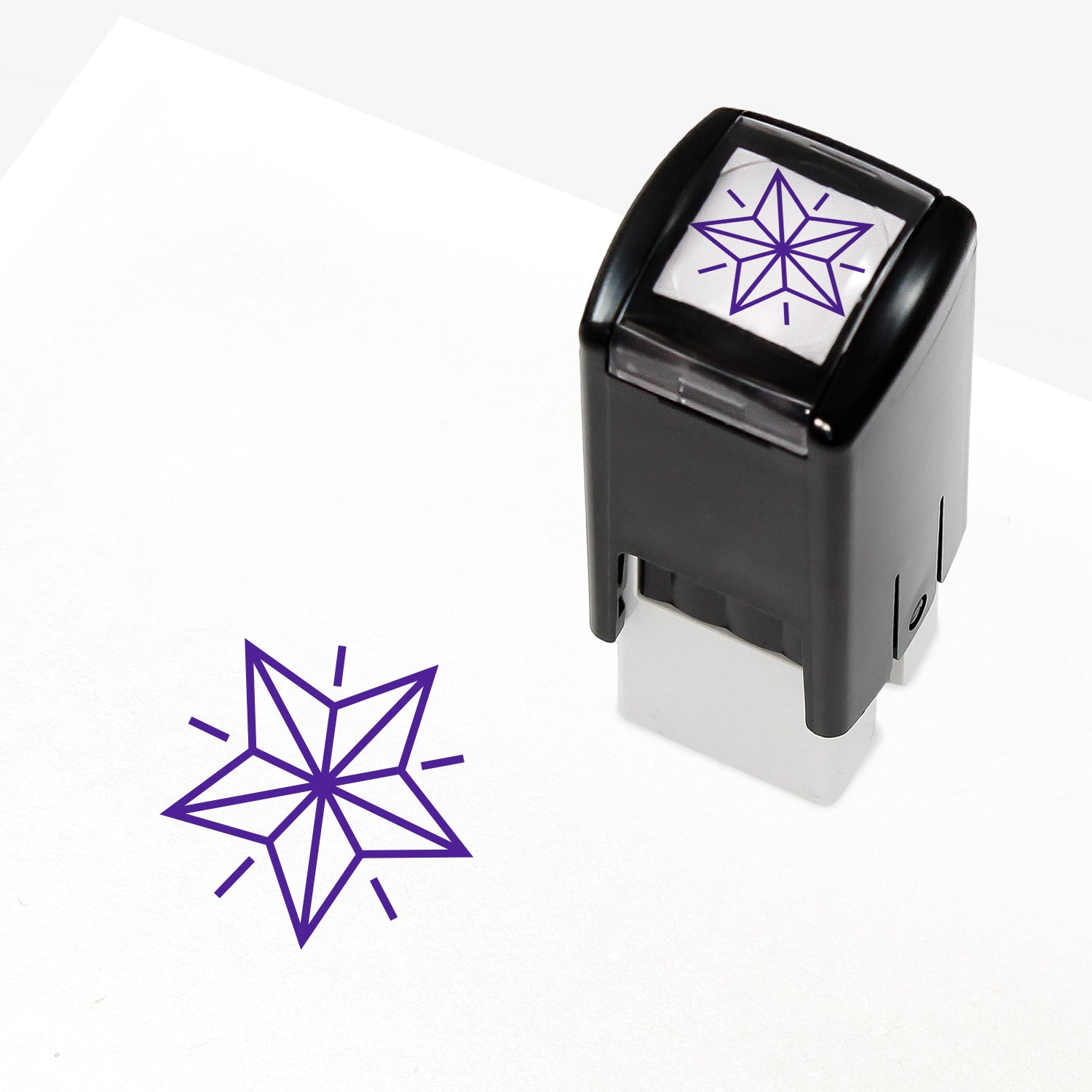 A 10mm self-inking stamp with a purple outline 3D style star central to the design.