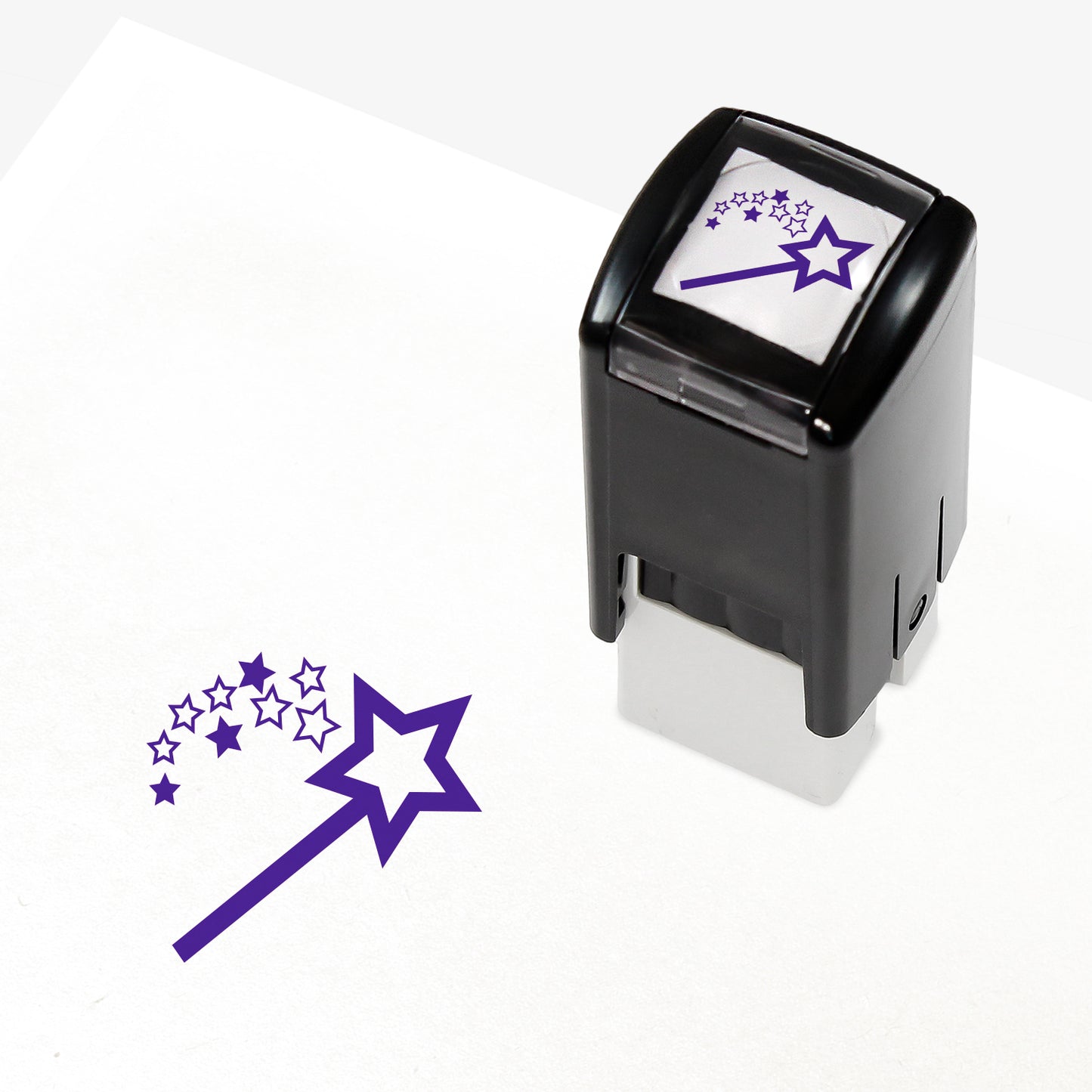A 10mm self-inking stamp with a purple wand emitting a shower of stars.
