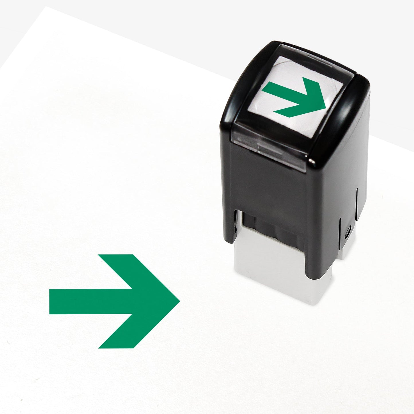A 10mm self-inking stamp with a green right-pointing arrow design central to the design