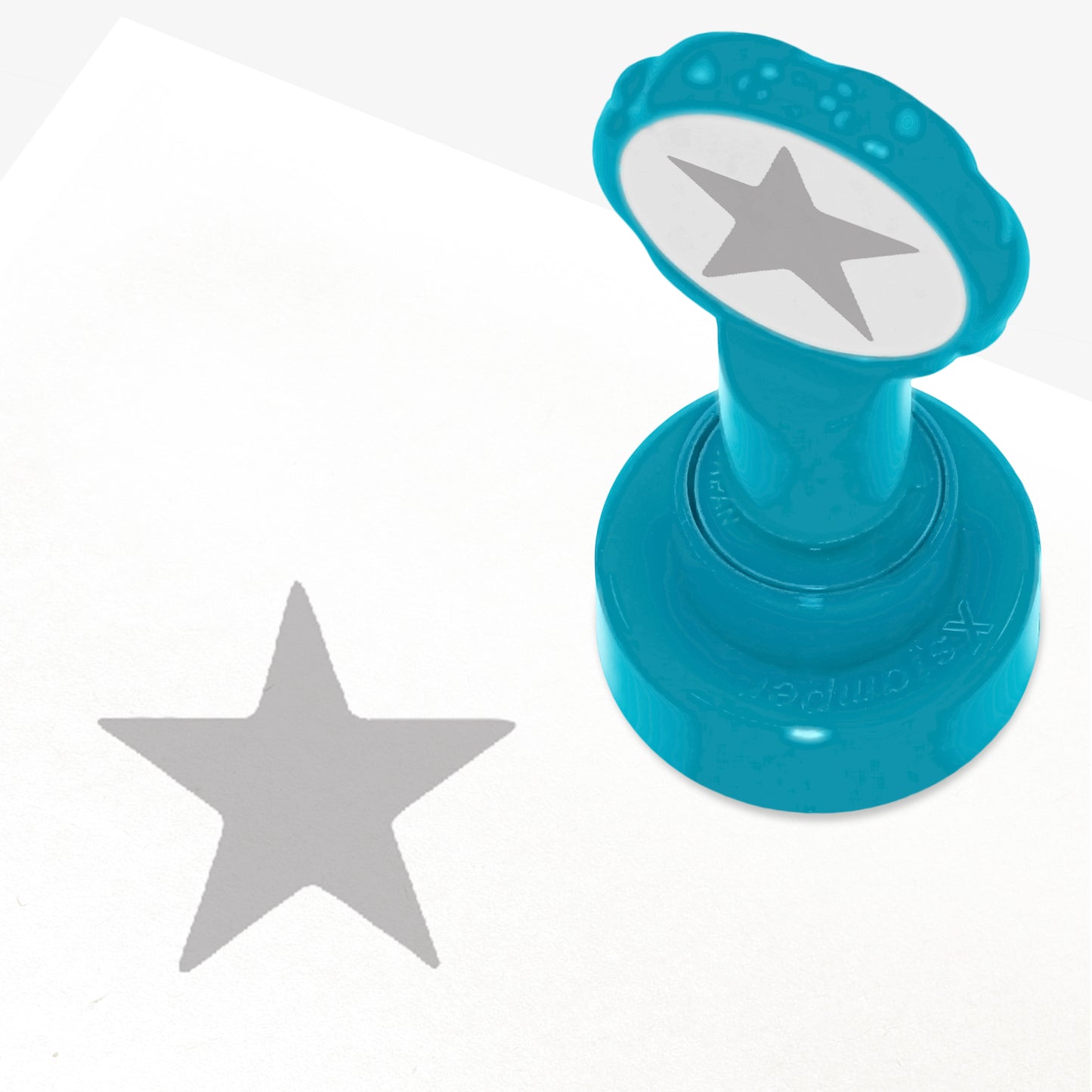 25mm self-inking stamper which leaves an impression of a silver star.
