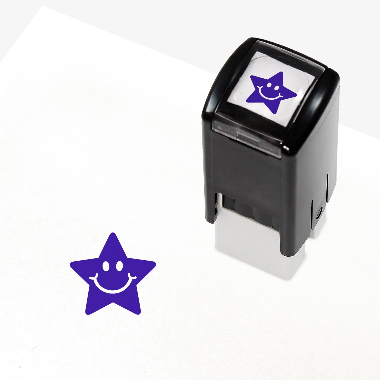 10mm self-inking stamper which leaves an impression of a purple star with white eyes and smile.