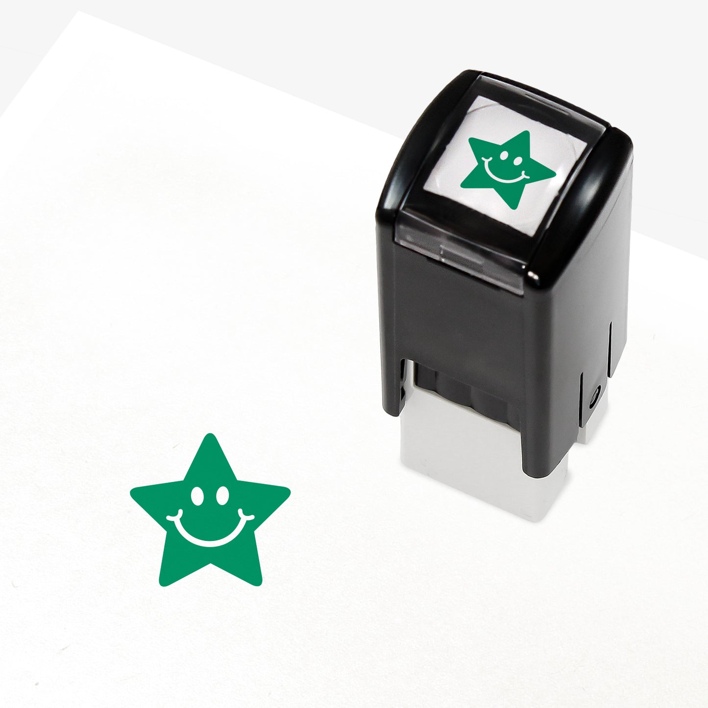 10mm self-inking stamper which leaves an impression of a green star with white eyes and smile.