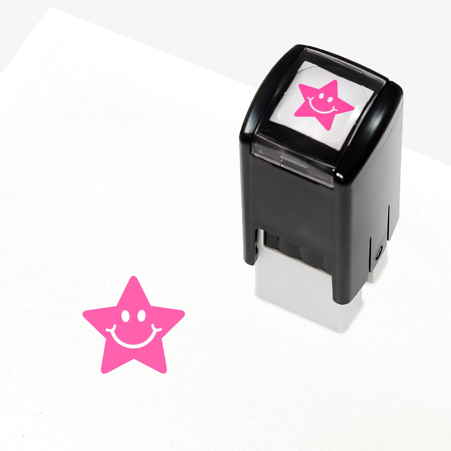 10mm self-inking stamper which leaves an impression of a pink star with white eyes and smile.