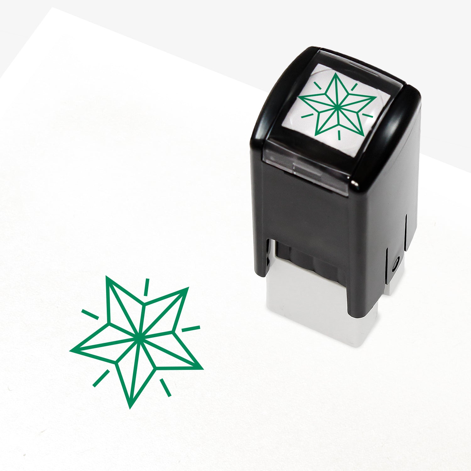 A 10mm self-inking stamp with a green outline 3D style star central to the design.