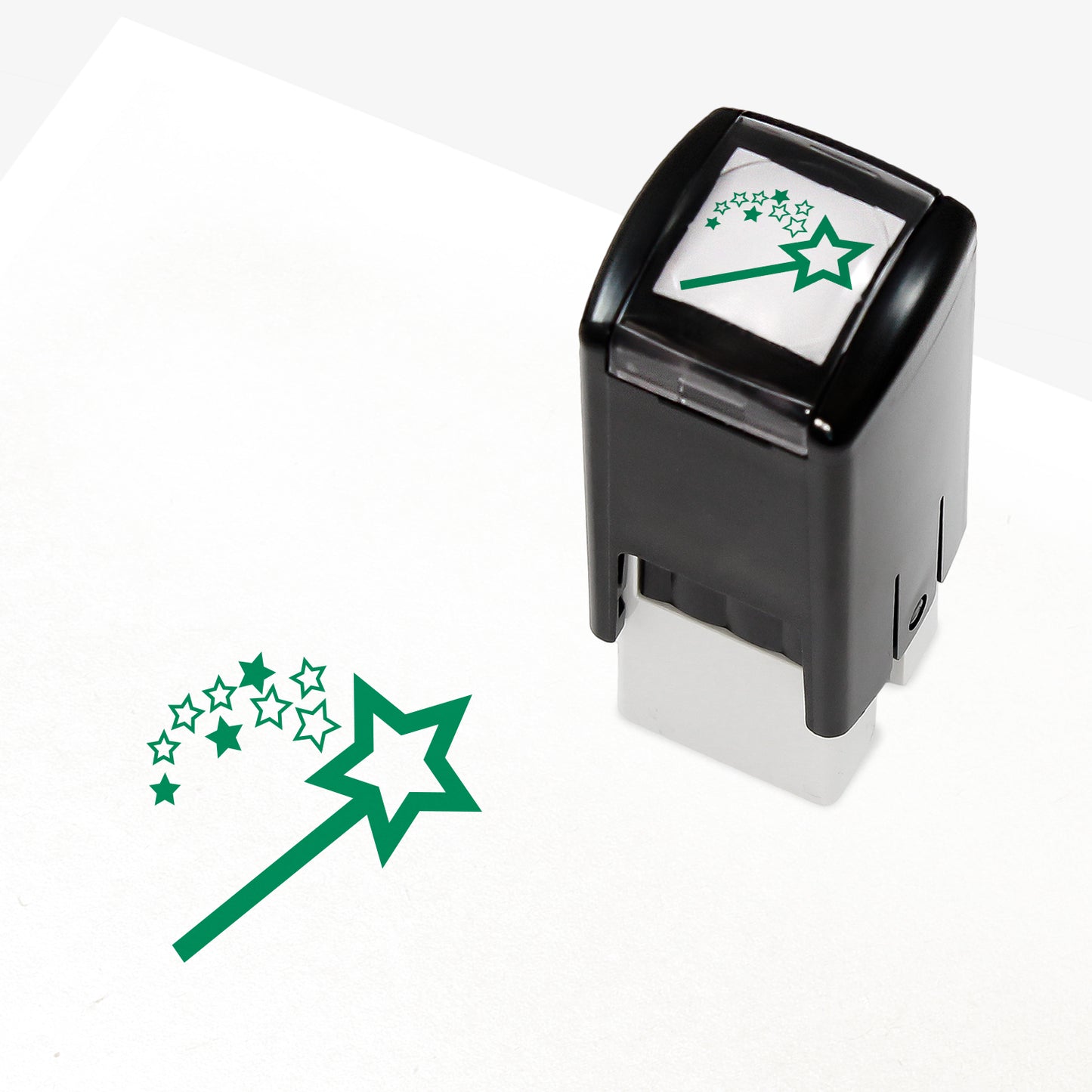 A 10mm self-inking stamp with a green wand emitting a shower of stars.