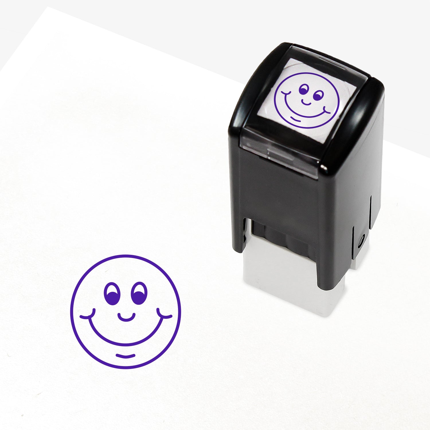 Purple 10mm pre-inked stamper featuring a smiling cartoon emoji face