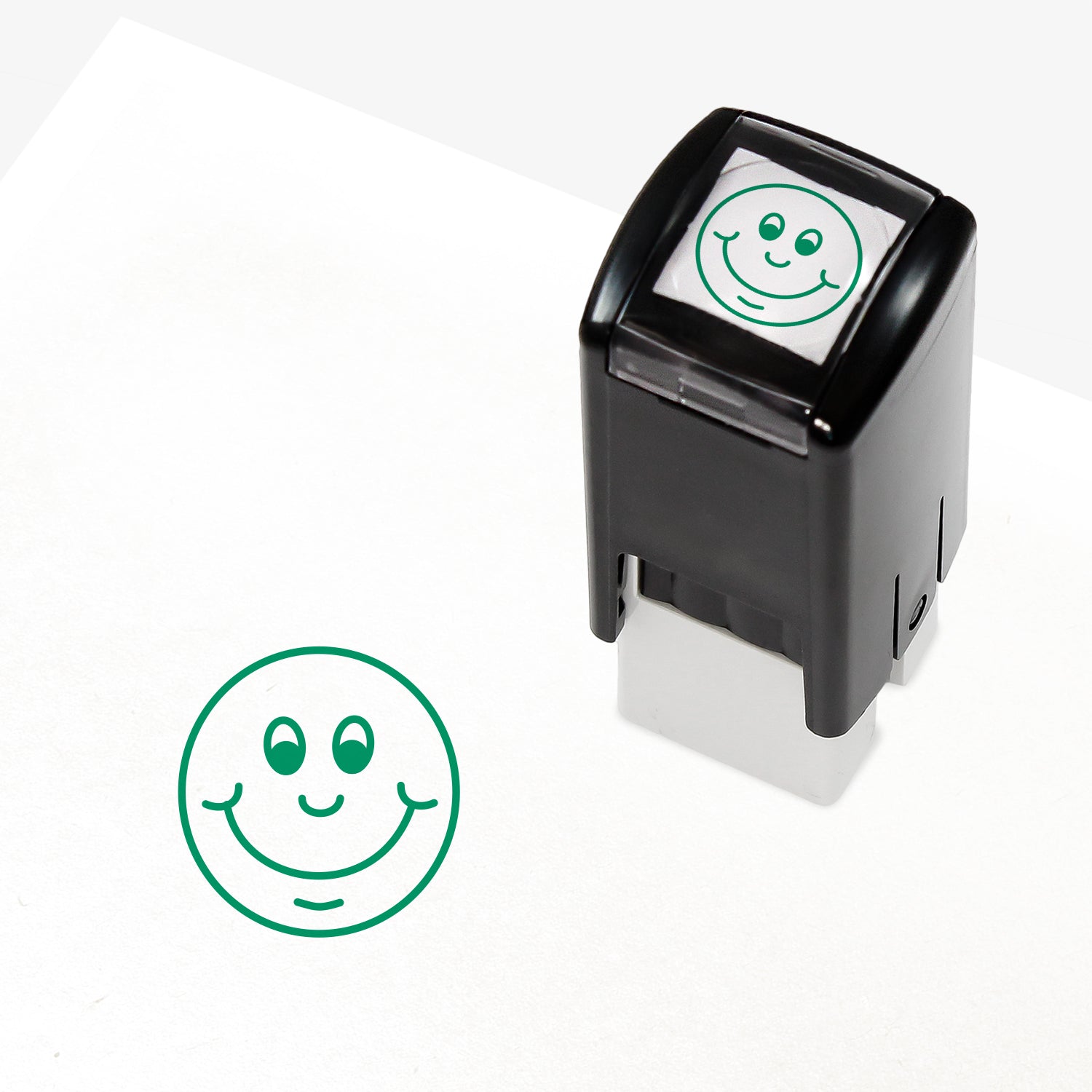 Green 10mm pre-inked stamper featuring a smiling cartoon emoji face