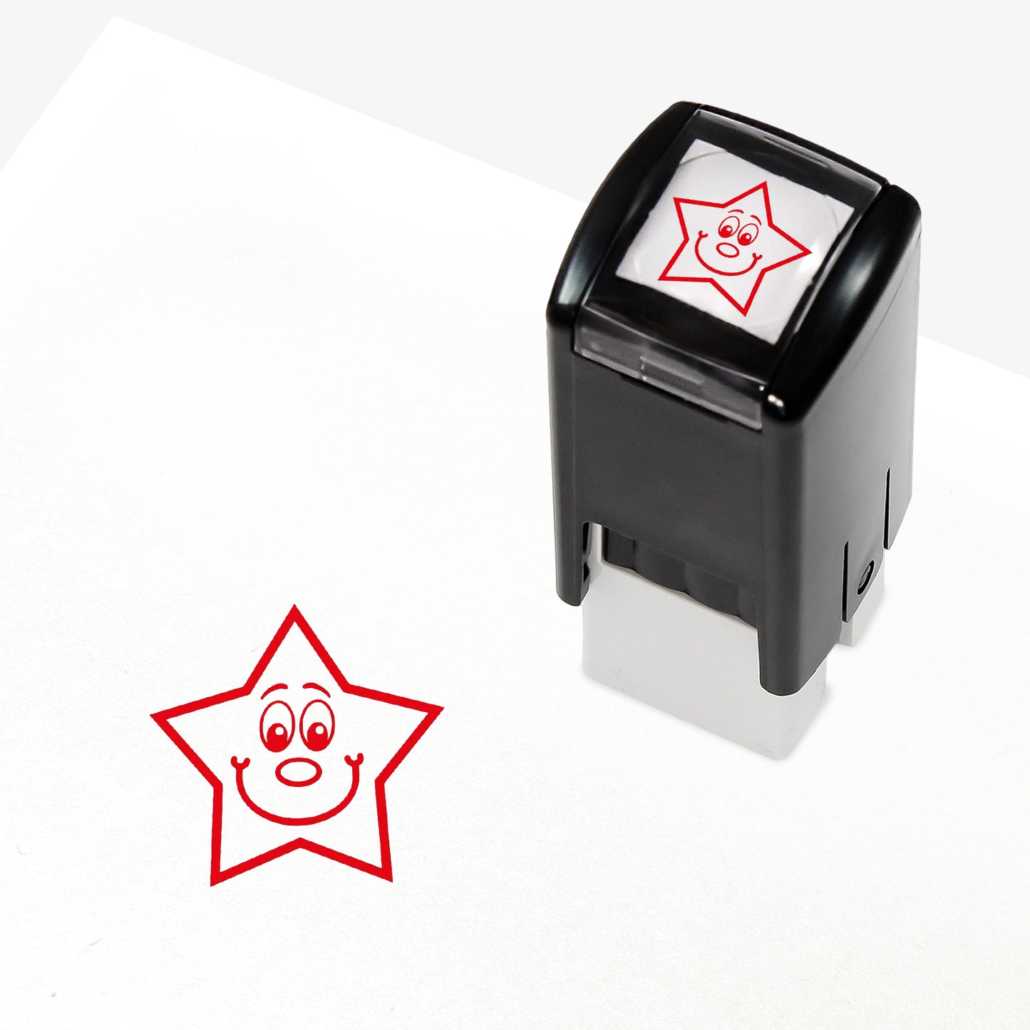 A 10mm self-inking stamp with a red smiling star central to the design