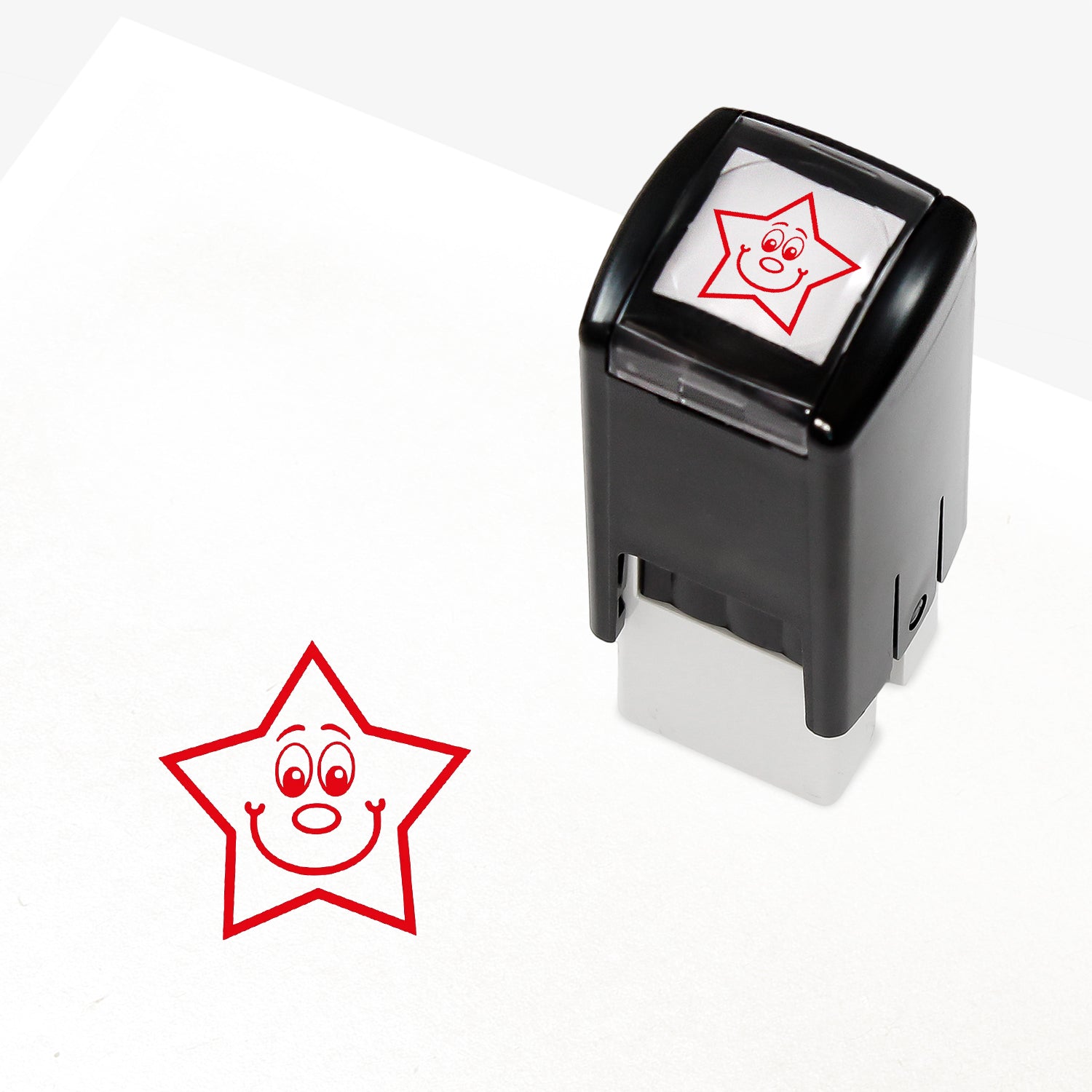 A 10mm self-inking stamp with a red smiling star central to the design