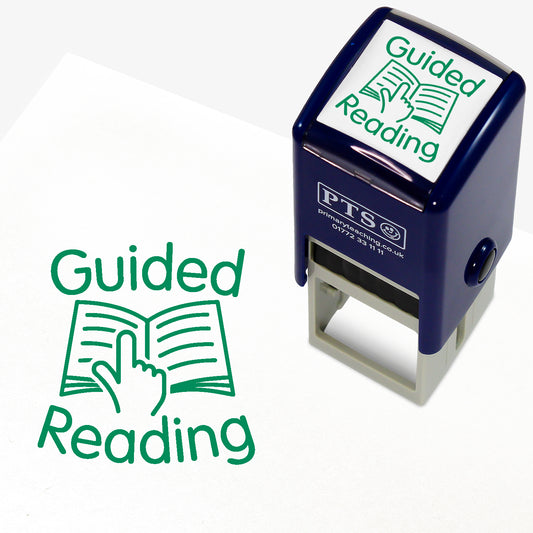 A 25mm round pre-inked teacher stamper with green ink, featuring an illustration a finger following text on an open booke, around which is the phrase 'Guided Reading'.