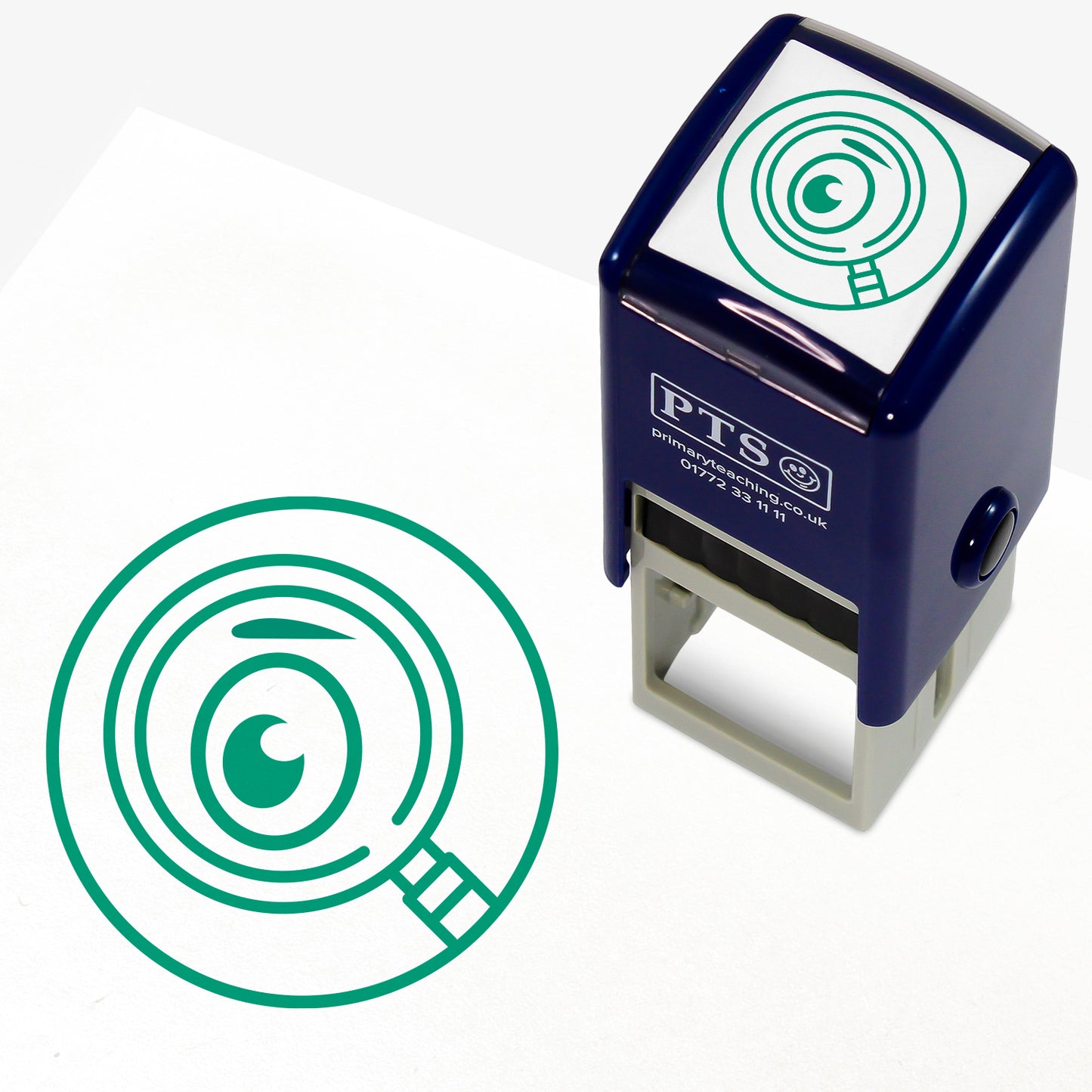 Proof Reading Stamper – 25mm pre-inked teacher stamp with green ink, featuring an eye in a magnifying glass, designed to help pupils read through work after completion.