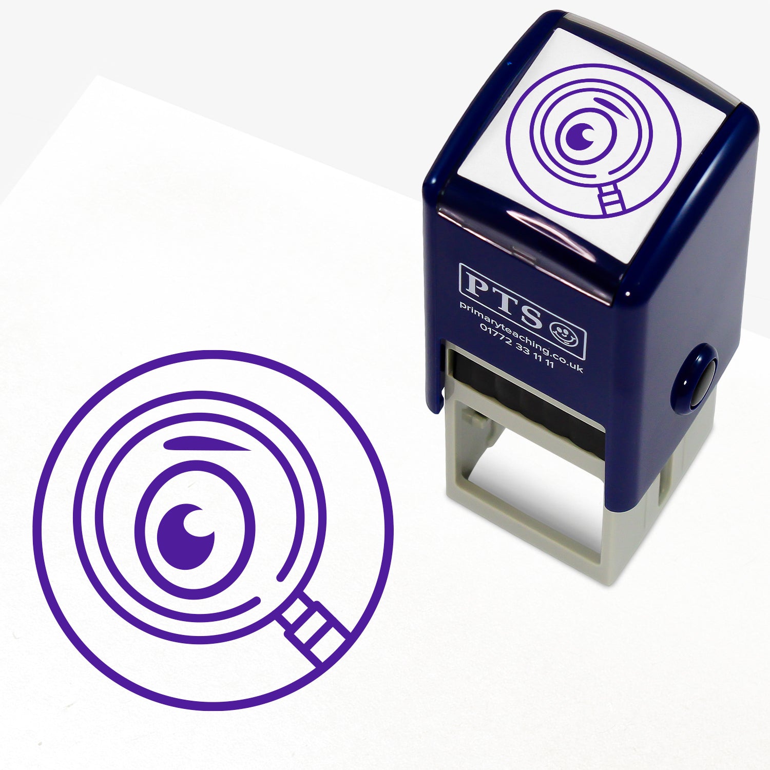 Proof Reading Stamper – 25mm pre-inked teacher stamp with purple ink, featuring an eye in a magnifying glass, designed to help pupils read through work after completion.